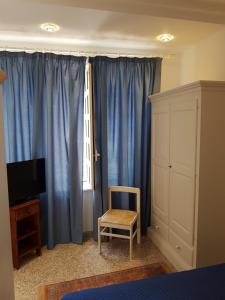 TV a/nebo společenská místnost v ubytování Suite Panoramic