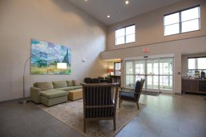 a living room with a couch and a table at Country Inn & Suites by Radisson, Boone, NC in Boone