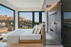 Posteľ alebo postele v izbe v ubytovaní Athens Avaton Suites + 25 fotografií