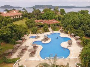 an aerial view of a pool at a resort at Occidental Papagayo - Adults Only All Inclusive in Papagayo, Guanacaste