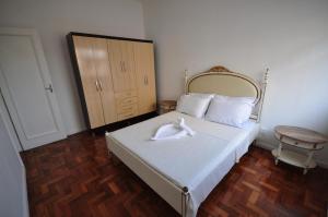 a bedroom with a bed with a white towel on it at Apartamento Barao da Torre 85 in Rio de Janeiro