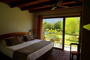 Ein Bett oder Betten in einem Zimmer der Unterkunft Hotel Pucon Green Park