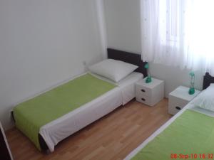 Giường trong phòng chung tại Villa Sonia Kaprije