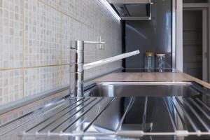 Kuchyň nebo kuchyňský kout v ubytování Apartment Pavic - Private parking