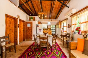 a dining room with a table and chairs at Aadonis traditional house on the Sea in Kolymvari +43 photos