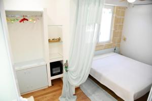 Katil atau katil-katil dalam bilik di B&B Al Vecchio Glicine
