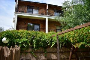a house with a fence in front of it at Vila Tudor Mamaia Nord in Mamaia Sat/Năvodari