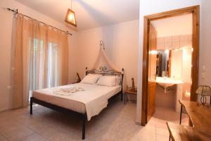 Postel nebo postele na pokoji v ubytování Ktima Kallitero Villas + 32 fotografií