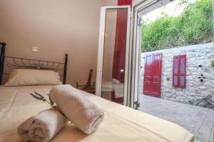 Postel nebo postele na pokoji v ubytování Ktima Kallitero Villas