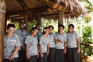 a group of people posing for a picture at Tokoriki Island Resort - Adults Only in Tokoriki