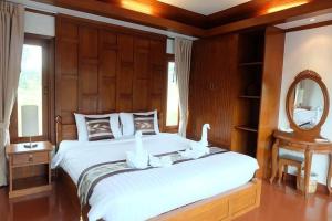 Uma cama ou camas num quarto em Kaya Mani Thai Villa resort