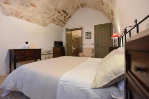Postel nebo postele na pokoji v ubytování Masseria Lamiola Piccola + 37 fotografií