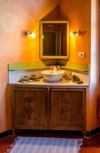 a bathroom with a sink and a mirror at Les Tournesols in Mallemort +97 photos