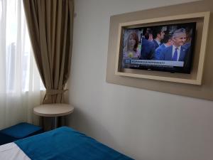 TV a/nebo společenská místnost v ubytování Hotel Delfin