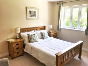 a bedroom with a large bed and a window at Moon House in Oxford