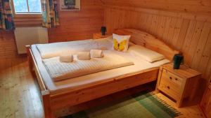 Postel nebo postele na pokoji v ubytování Almchalet Orter