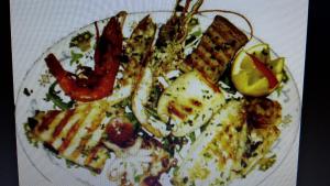 a plate of food on a white plate at Villa Salvatore in San Leone
