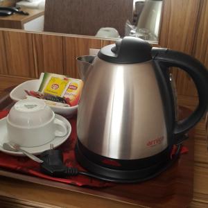 a tea kettle is sitting on a table at Buyuk Hotel in Kayseri