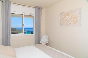 Postel nebo postele na pokoji v ubytování UHC Scala Mar Apartments