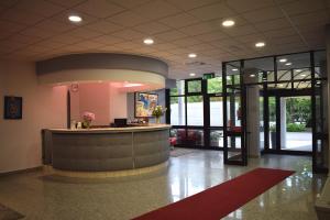 a lobby with a reception desk in a building at Hotel Baffo Rosso in Alba Adriatica +37 photos