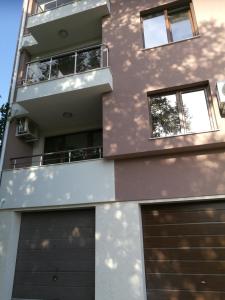 a building with two garage doors in front of it at Apartment Kate in Plovdiv
