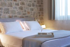 Postel nebo postele na pokoji v ubytování Ionian Horizon Villas