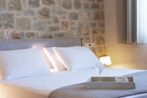 Postel nebo postele na pokoji v ubytování Ionian Horizon Villas