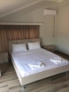 Letto o letti in una camera di David Palace Hotel Ureki