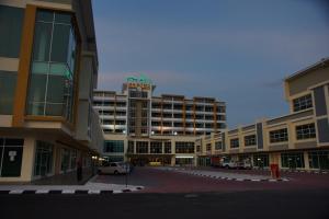 a building with a hotel sign on top of it at MH Sentral Hotel Sg Siput in Ipoh