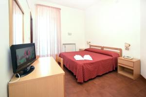 Postel nebo postele na pokoji v ubytování Hotel Timiama