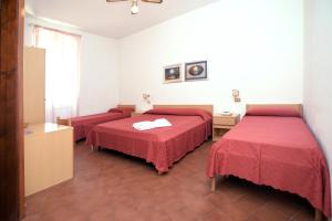 Postel nebo postele na pokoji v ubytování Hotel Timiama