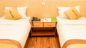 Una cama o camas en una habitación de Hotel Lapha