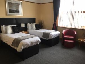 Кровать или кровати в номере Woodlands Guest House