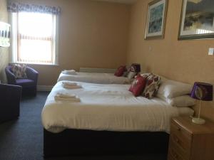 Кровать или кровати в номере Woodlands Guest House