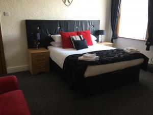 Кровать или кровати в номере Woodlands Guest House