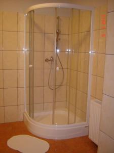 a shower with a glass door in a bathroom at Zajazd Wrocławski in Kąty Wrocławskie