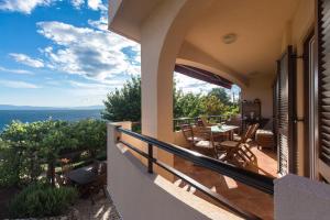 a balcony of a house with a view of the ocean at Captain's Apartment with Sea View in Kraljevica