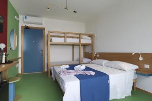 a bedroom with a bed with two pillows on it at Senia_rooms_design in Santa Maria al Bagno