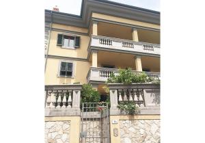 a building with balconies on the side of it at Appartamenti fronte mare in Castiglioncello