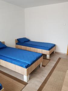 Postel nebo postele na pokoji v ubytování Bistrička stanica