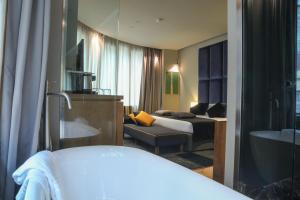 Voodi või voodid majutusasutuse Triviho Hotel toas
