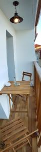 a room with a wooden table and a bench at A Casiña de Dina in Finisterre