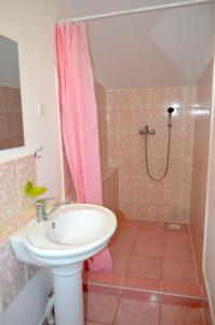 a bathroom with a sink and a shower at Osobyi Guest house in Cholpon-Ata