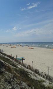 a beach with the ocean in the background at Willa Tina in Karwia