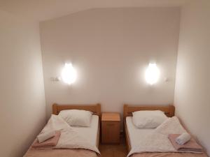 Cama ou camas em um quarto em Guest House Plitvicki Emaus