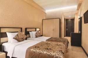 Postel nebo postele na pokoji v ubytování Days Hotel By Wyndham Baku