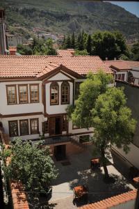 an aerial view of a house with a tree at Melekli Konak in Amasya