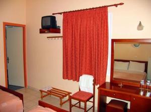 Postel nebo postele na pokoji v ubytování Apollon Hotel