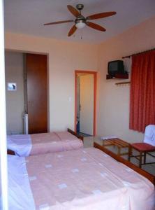 Postel nebo postele na pokoji v ubytování Apollon Hotel
