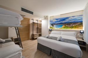 Postel nebo postele na pokoji v ubytování Atotxa Rooms